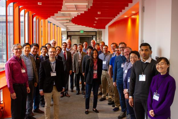 men and women standing in a group